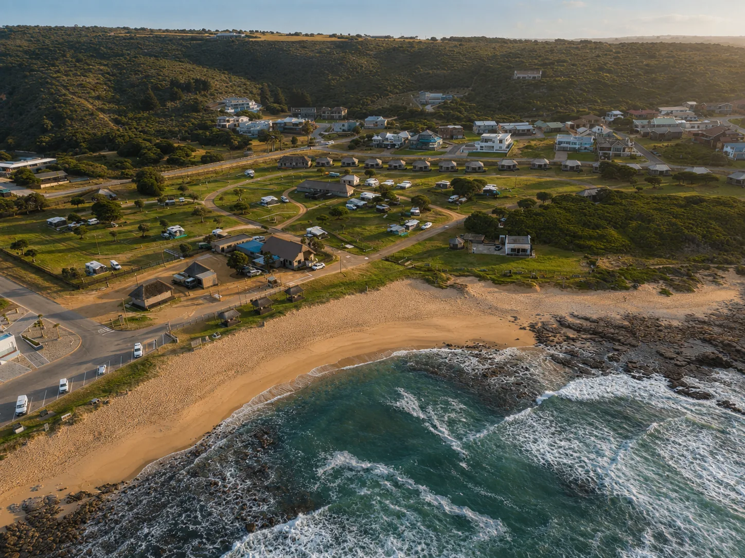 Rugged Jongensfontein shoreline with rock pools at sunset